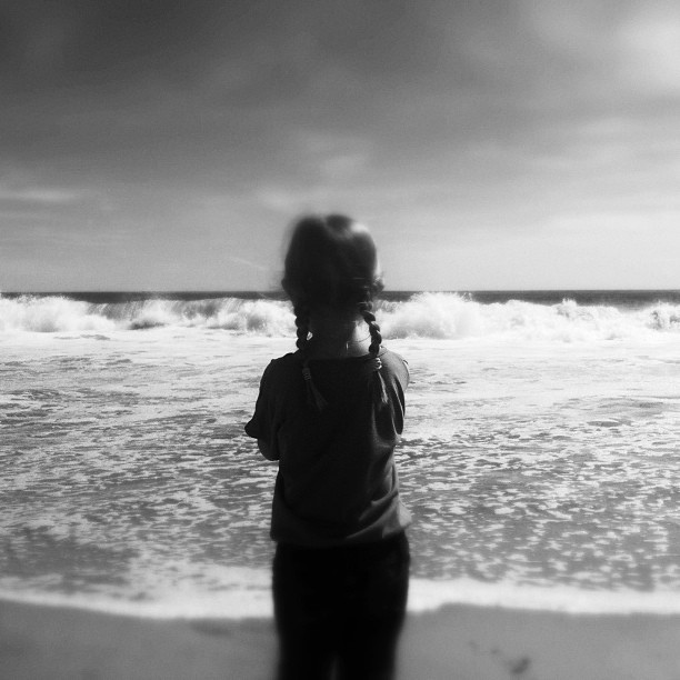 Picture of child looking at waves