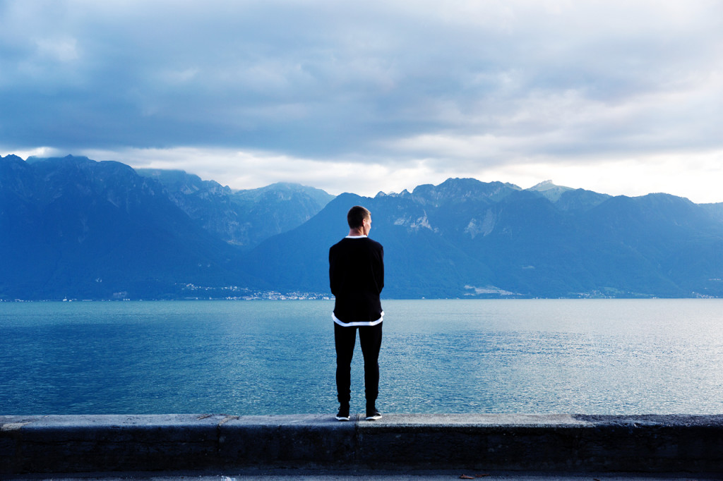 Picture of man looking over lake