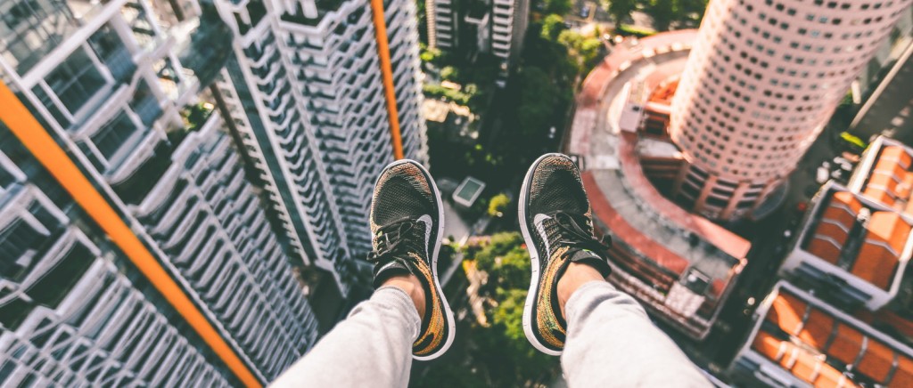 Picture of legs dangling over building