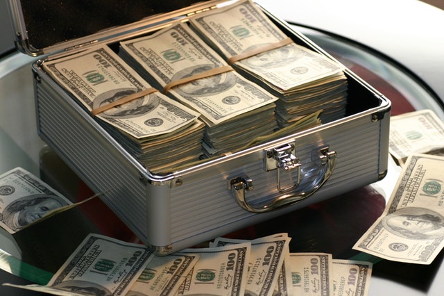 Open briefcase stuffed with cash