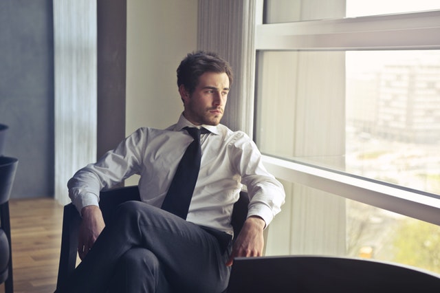 Stylish young executive posing in office