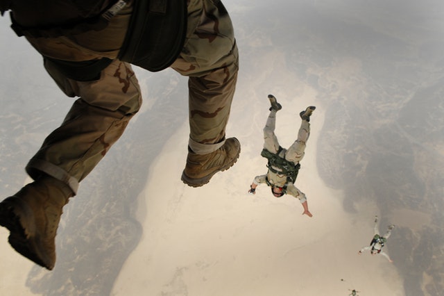 Soldiers skydiving out of plane