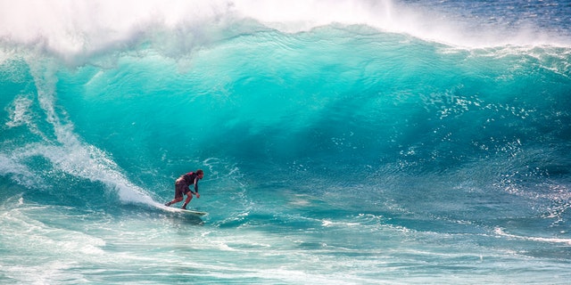 Man surfing huge waves