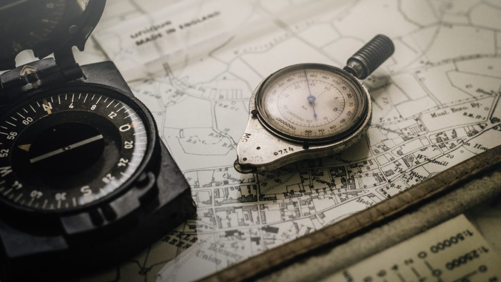 Compass on map signifying financial journey